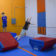 Web header Little boy making jump in obstacle course